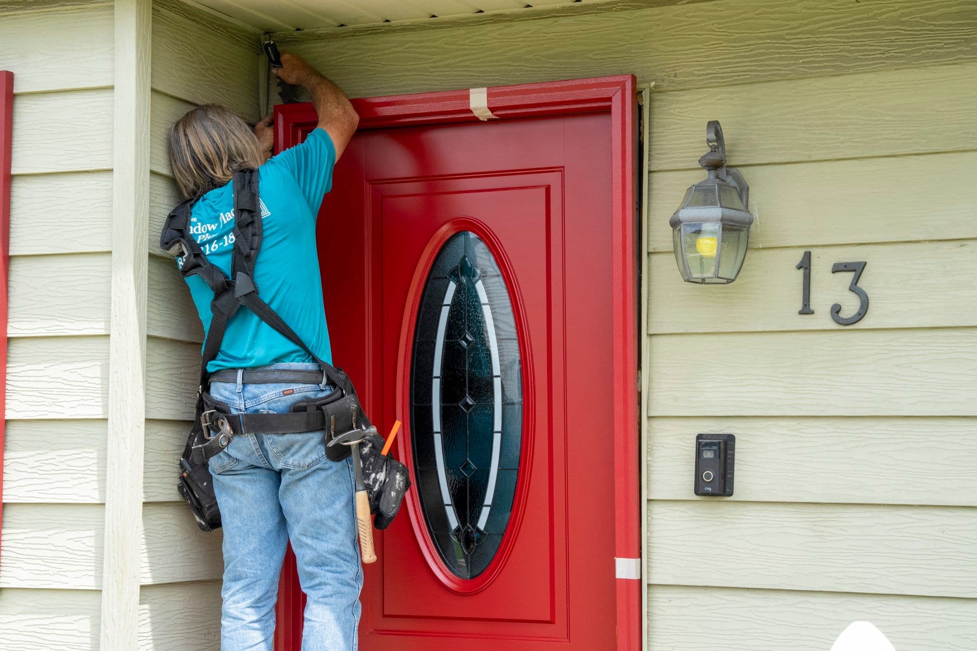 person installing entryway door