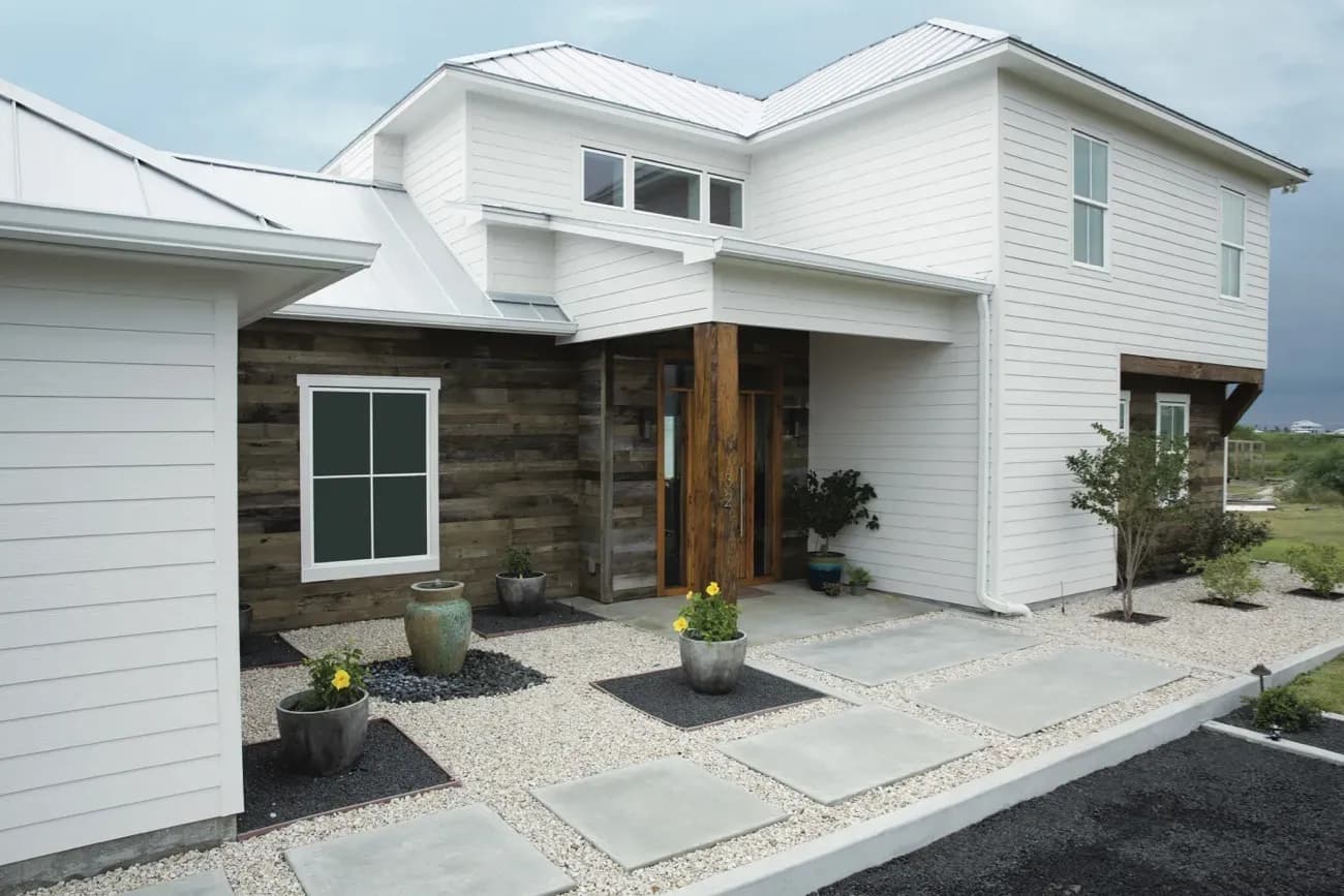 White siding on a oak wood house